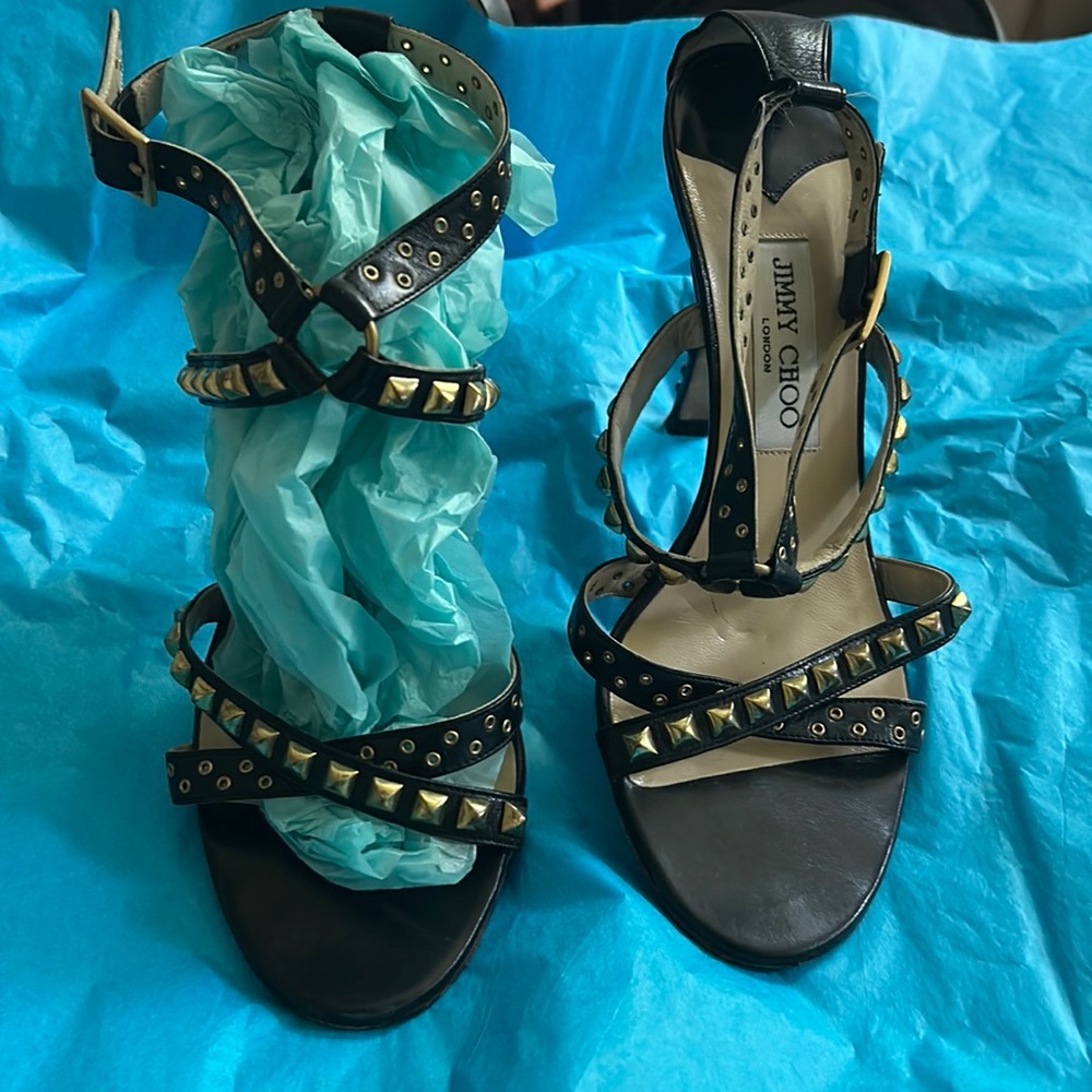 Jimmy Choo strapped high heel black leather with gold studs & grommets. 391/2